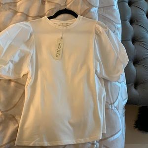 White top… puffy sleeves